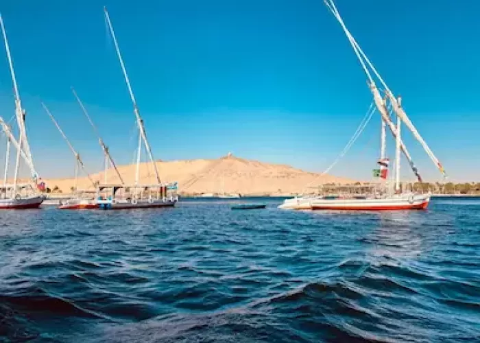 Sailing on the Nile River in Egypt with scenic views and traditional boats