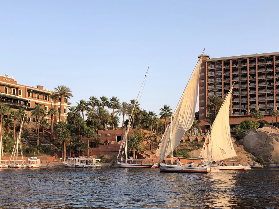 Scenic felucca boat sailing peacefully on the Nile in Aswan.
